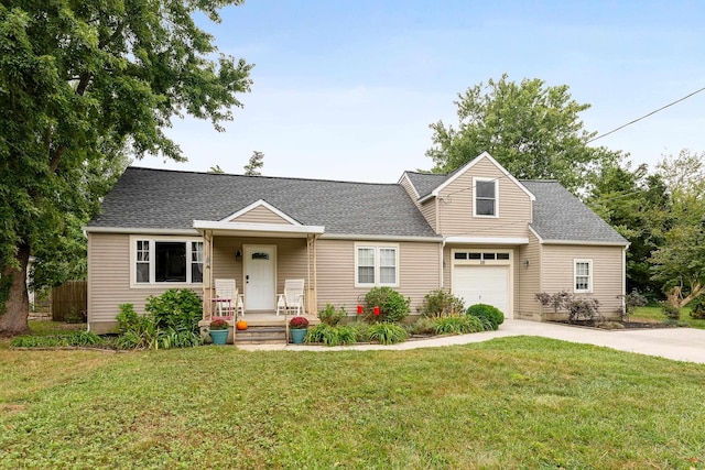 view of front of house with a front yard and a garage