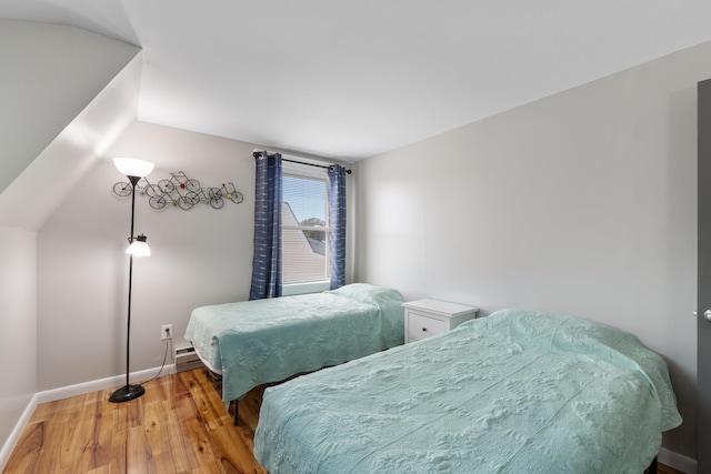 123 Broadway, Villas, NJ 08251 - bedroom featuring wood finished floors, baseboards, and vaulted ceiling
