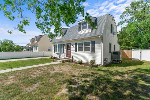 123 Broadway, Villas, NJ 08251 - view of front of house with a gate, central AC unit, and a gambrel roof