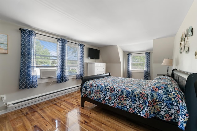 123 Broadway, Villas, NJ 08251 - bedroom featuring baseboard heating, hardwood / wood-style floors, baseboards, and cooling unit
