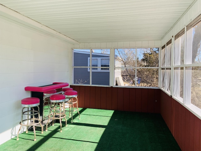 unfurnished sunroom featuring a wealth of natural light