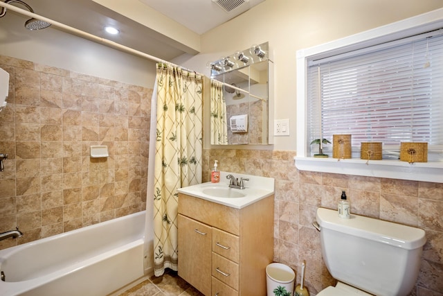 208 E Maple Ave, Wildwood, NJ 08260 - full bathroom with tile patterned floors, toilet, tile walls, vanity, and shower / bath combination with curtain