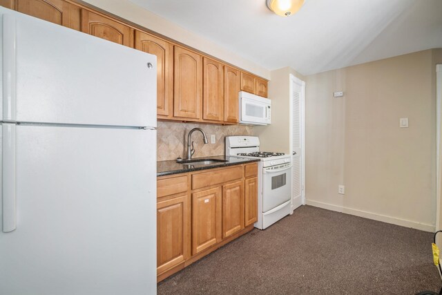 208 E Maple Ave, Wildwood, NJ 08260 - kitchen with sink, dark carpet, white appliances, dark stone counters, and decorative backsplash