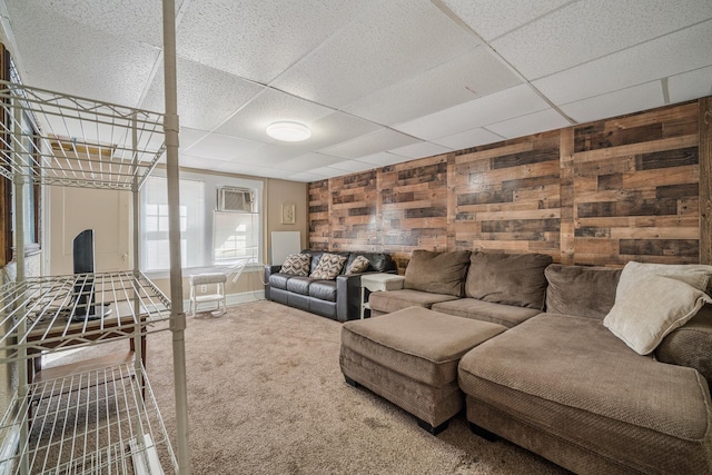 208 E Maple Ave, Wildwood, NJ 08260 - living room featuring carpet flooring, a paneled ceiling, and wood walls