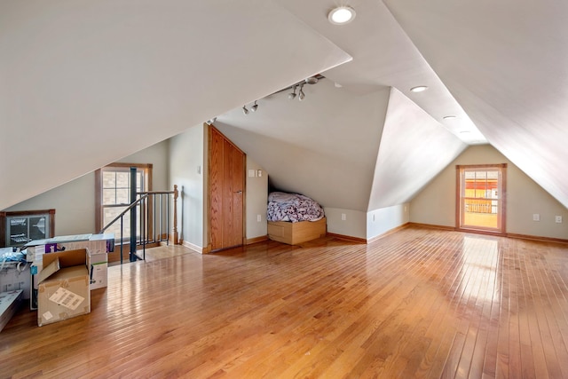 208 E Maple Ave, Wildwood, NJ 08260 - additional living space featuring light hardwood / wood-style flooring, a healthy amount of sunlight, and vaulted ceiling