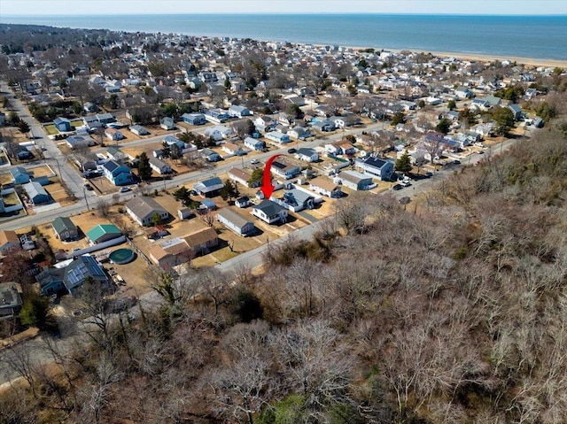 birds eye view of property featuring a residential view and a water view