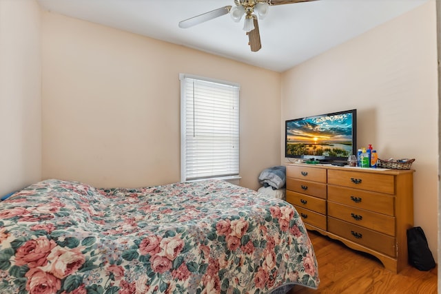 bedroom with light wood-type flooring and ceiling fan