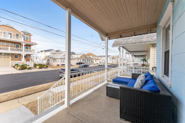 balcony with a residential view and a porch