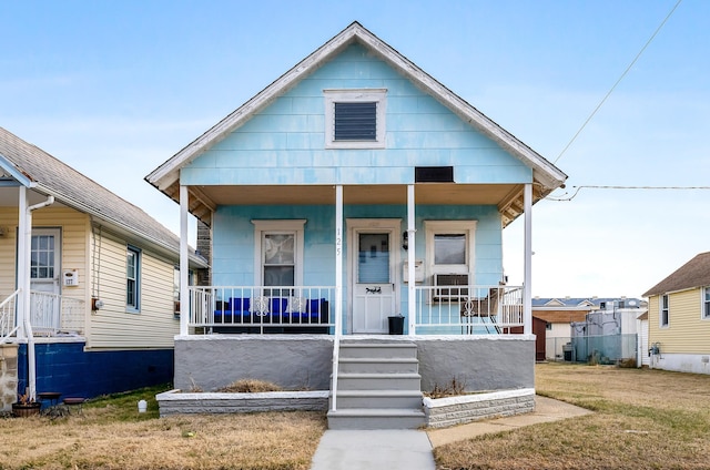 view of front of house with central AC unit and covered porch