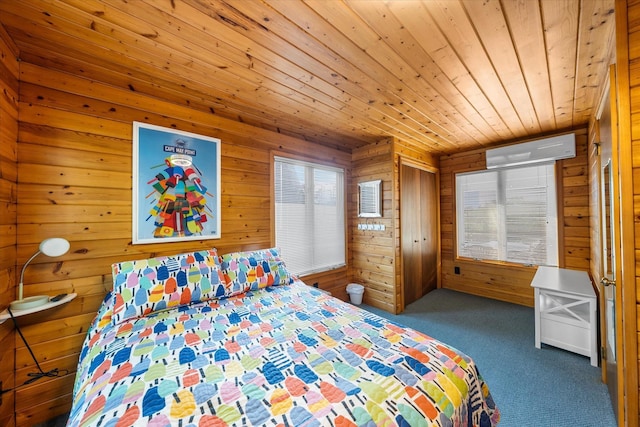 304 Alexander Ave, Cape May Point, NJ 08212 - carpeted bedroom with a wall mounted air conditioner, wooden ceiling, and wood walls