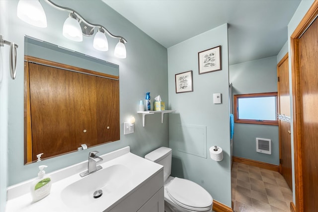 304 Alexander Ave, Cape May Point, NJ 08212 - full bathroom with tile patterned floors, heating unit, toilet, vanity, and baseboards