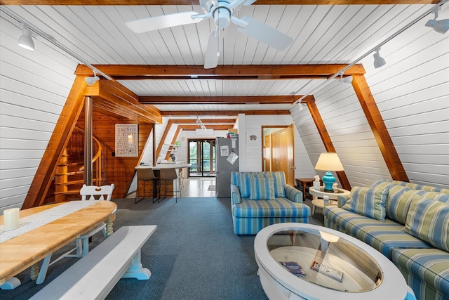 304 Alexander Ave, Cape May Point, NJ 08212 - carpeted living area featuring wood walls, a ceiling fan, track lighting, and beamed ceiling
