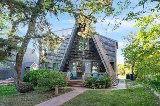 304 Alexander Ave, Cape May Point, NJ 08212 - view of front facade with a shingled roof and a front yard