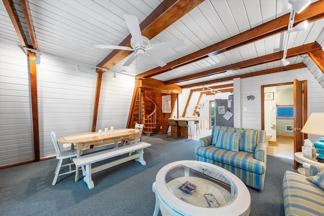 304 Alexander Ave, Cape May Point, NJ 08212 - living room featuring wood walls, beam ceiling, a ceiling fan, and carpet