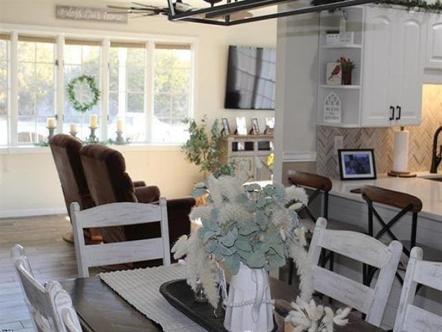 dining space with light hardwood / wood-style floors