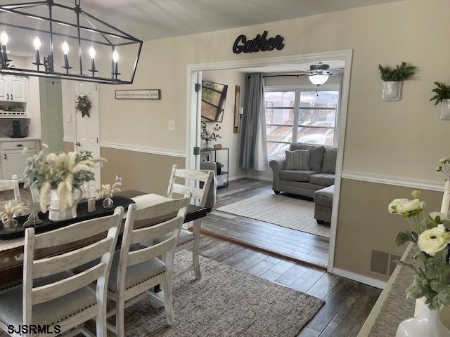 dining space featuring dark hardwood / wood-style floors and ceiling fan