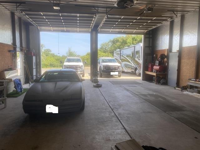 garage featuring a carport