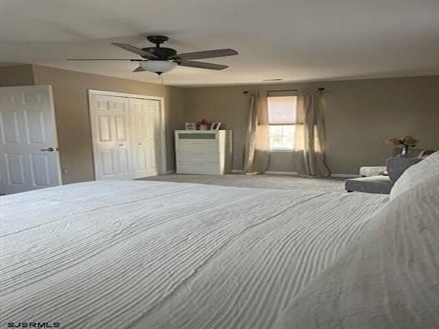 unfurnished bedroom featuring a closet and ceiling fan