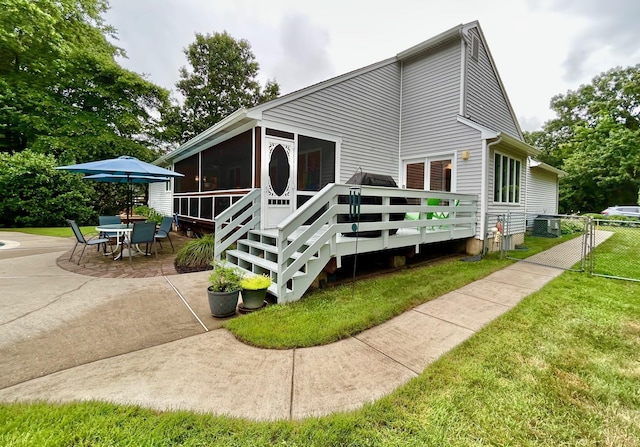 46 Summer Cir, North Cape May, NJ 08204 - rear view of house featuring a sunroom, a patio, a deck, and outdoor dining area