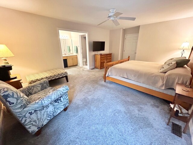 46 Summer Cir, North Cape May, NJ 08204 - bedroom with light carpet, ensuite bathroom, and ceiling fan