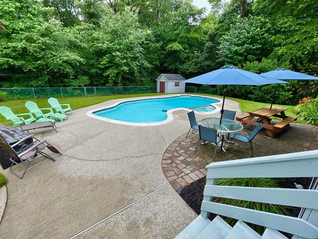 46 Summer Cir, North Cape May, NJ 08204 - view of pool featuring a patio, a storage shed, view of wooded area, and outdoor dining space