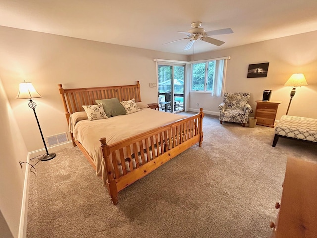 46 Summer Cir, North Cape May, NJ 08204 - carpeted bedroom with access to outside and a ceiling fan