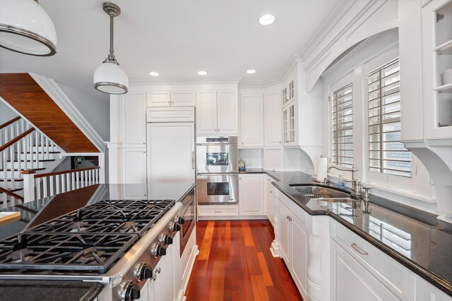 73 E 25th St, Avalon, NJ 08202 - kitchen featuring stainless steel appliances, dark wood-type flooring, recessed lighting, white cabinets, and decorative light fixtures