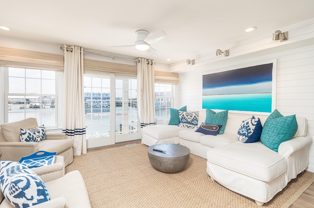 328 83rd St, Stone Harbor, NJ 08247 - living area featuring a water view, a ceiling fan, wood walls, wood finished floors, and recessed lighting
