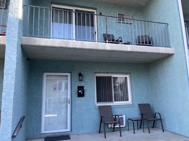 property entrance with a balcony