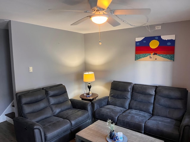 living room featuring ceiling fan and wood-type flooring