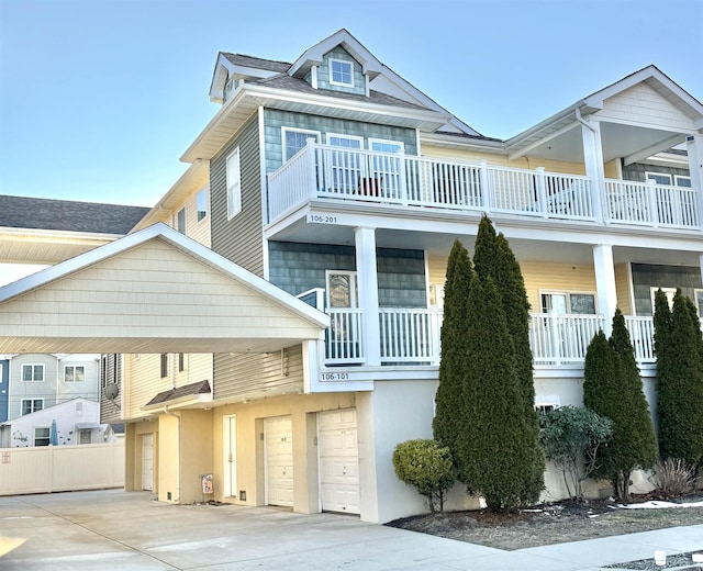 townhome / multi-family property featuring a garage and a balcony