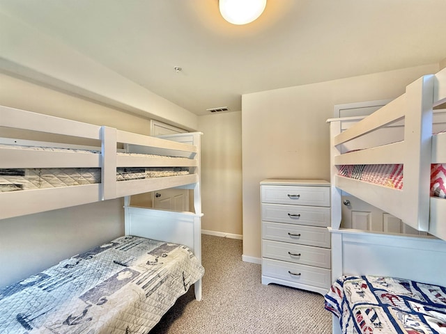 bedroom featuring light colored carpet