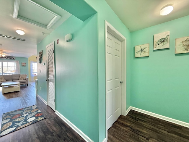 hall featuring dark wood-type flooring