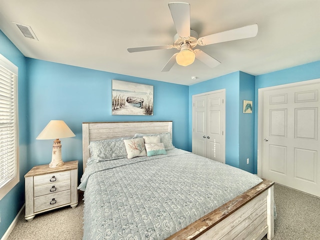 bedroom with a closet, ceiling fan, and carpet