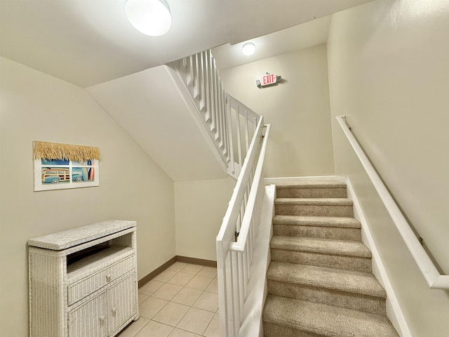 stairway featuring tile patterned flooring