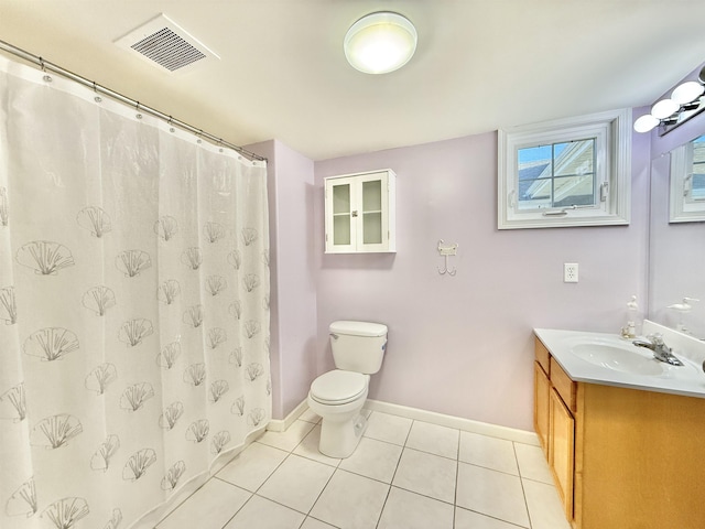 bathroom featuring vanity, curtained shower, tile patterned floors, and toilet