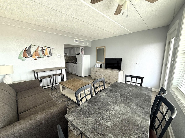9103 Atlantic Ave Unit 413, Wildwood Crest, NJ 08260 - dining space with a ceiling fan, a textured ceiling, and a textured wall