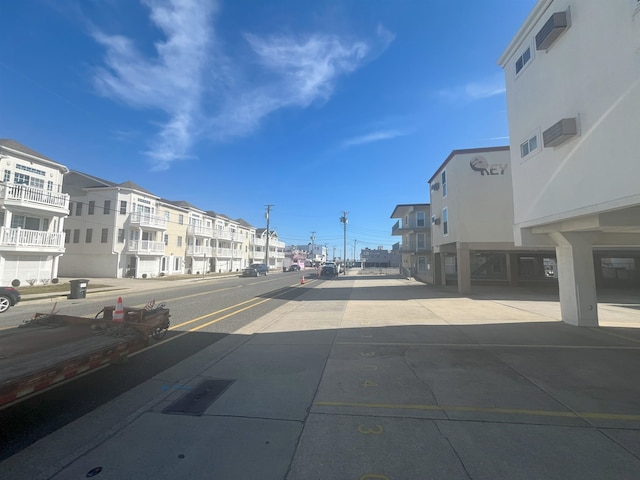 view of street with sidewalks and curbs