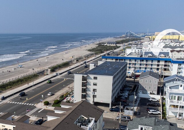 aerial view featuring a view of the beach and a water view