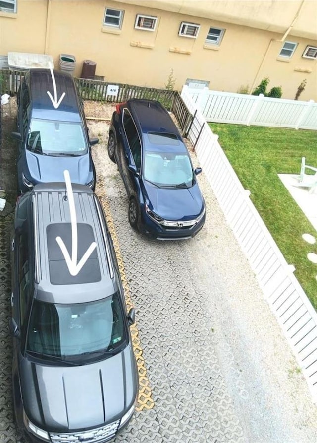 view of car parking with fence