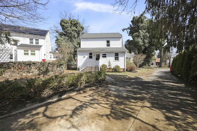 back of property with driveway