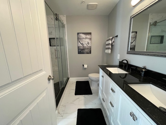 bathroom with an enclosed shower, vanity, and toilet