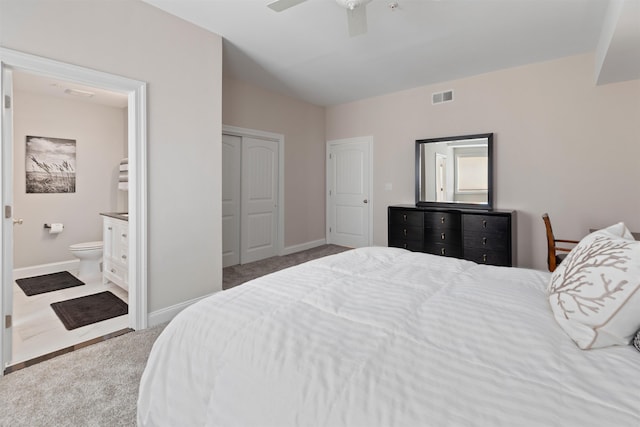 carpeted bedroom featuring ceiling fan, a closet, and connected bathroom