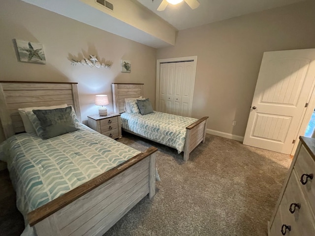 bedroom with ceiling fan, a closet, and dark carpet