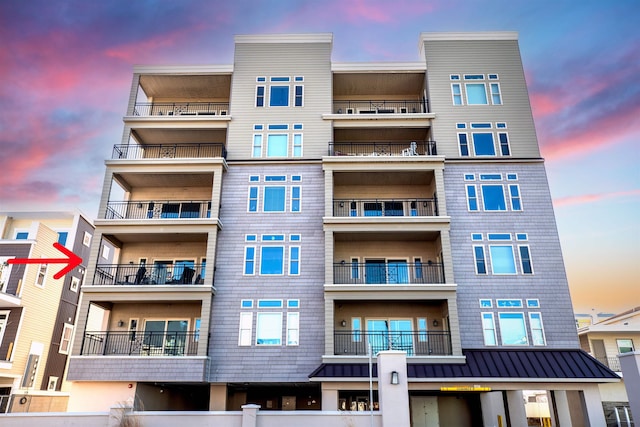 view of outdoor building at dusk