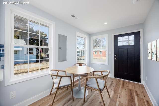 foyer entrance featuring electric panel, visible vents, baseboards, light wood-type flooring, and recessed lighting