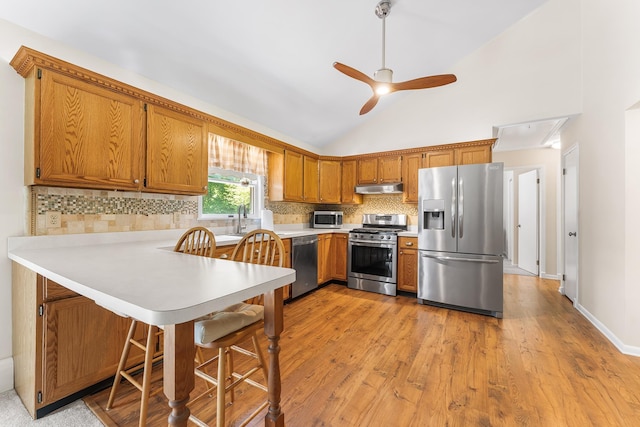 1431 Burleigh Rd, Green Creek, NJ 08210 - kitchen featuring stainless steel appliances, extractor fan, a peninsula, light countertops, and lofted ceiling