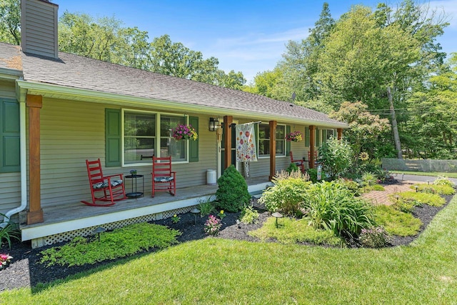 1431 Burleigh Rd, Green Creek, NJ 08210 - view of front facade featuring covered porch, a chimney, and a front yard