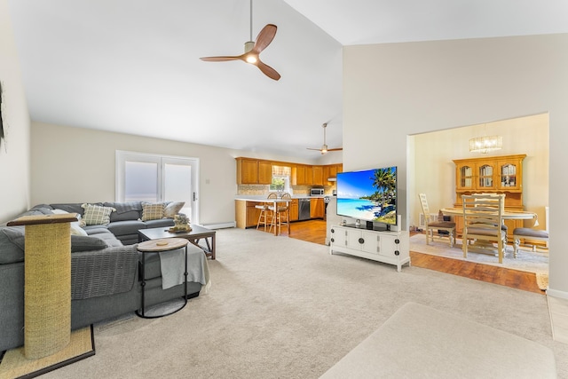 1431 Burleigh Rd, Green Creek, NJ 08210 - living area featuring light carpet, ceiling fan, high vaulted ceiling, and a chandelier