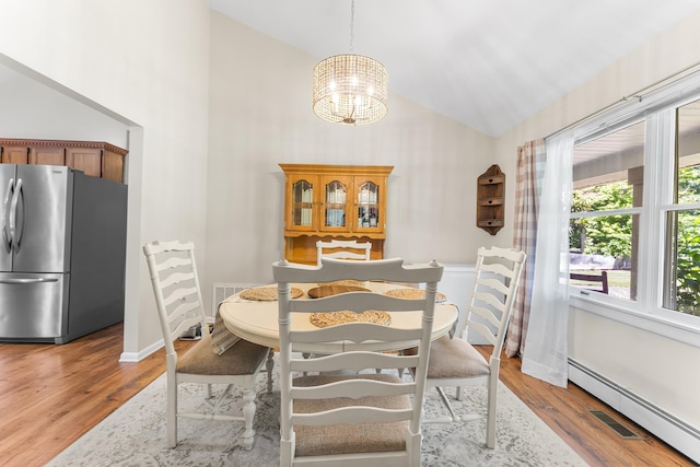 1431 Burleigh Rd, Green Creek, NJ 08210 - dining space with high vaulted ceiling, a chandelier, a baseboard radiator, and wood finished floors